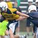 Saline High School football player looks to run the ball past a defender at the school on Monday, August 12, 2013. Melanie Maxwell | AnnArbor.com